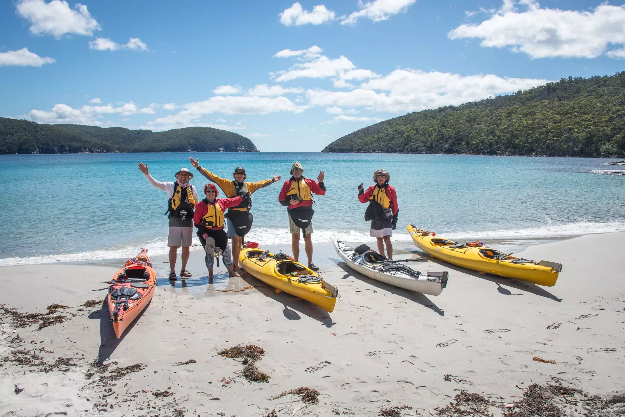group of kayakers smiling